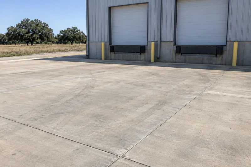 Concrete Contractor in McGregor, TX, example photo: a concrete loading-dock apron at an industrial building