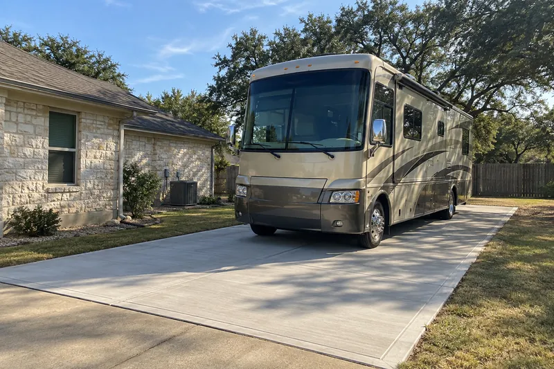 Concrete Pads in Waco, TX, example photo: rV parked on a new concrete pad beside a house