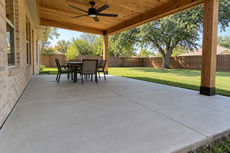Concrete Patios in Mount Calm, TX, example photo: concrete patio under a cedar patio cover