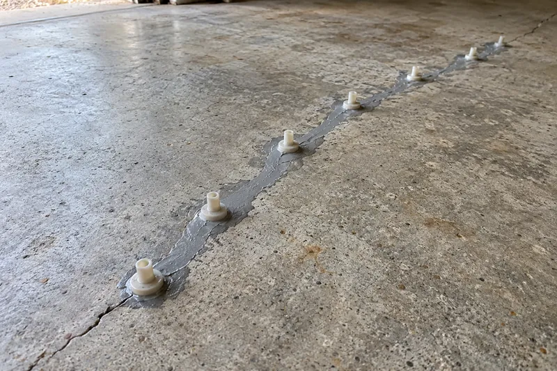Concrete Repair in Lorena, TX, example photo: injection ports set along a crack for epoxy repair
