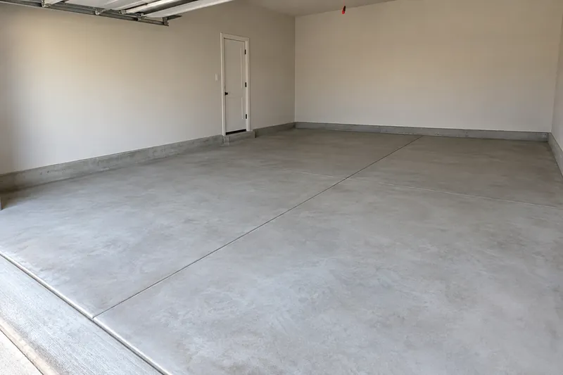 Concrete Slabs in Abbott, TX, example photo: clean new concrete floor in an empty garage