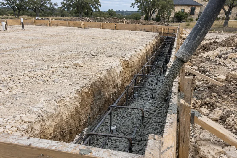 Concrete Slabs in McGregor, TX, example photo: concrete placed into grade beams from a pump hose